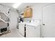 Functional laundry room equipped with washer, dryer, and cabinetry, offering convenience and storage at 13 Marywood Dr, Greenfield, IN 46140