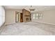 Spacious living room featuring a brick fireplace, built-in shelving, and large windows at 13 Marywood Dr, Greenfield, IN 46140