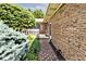 Close up of brick pathway leading to the house, surrounded by lush greenery and landscaping at 13 Marywood Dr, Greenfield, IN 46140