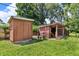 Backyard featuring a large grassy area, a storage shed, and a pet area with space for outdoor relaxation at 1340 Eustis Dr, Indianapolis, IN 46229