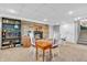 Cozy basement with a fireplace, stone accent wall, and staircase at 1340 Eustis Dr, Indianapolis, IN 46229