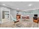 Finished basement with seating, TV, and a laundry area in the background at 1340 Eustis Dr, Indianapolis, IN 46229
