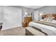 Neutral bedroom with closet, dresser and bedside table at 1340 Eustis Dr, Indianapolis, IN 46229