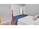 Neutrally decorated bedroom with a wooden bed frame and a view of the closet at 1340 Eustis Dr, Indianapolis, IN 46229