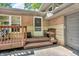 Charming front porch with seating, a small bench, brick accents, and a cozy entrance at 1340 Eustis Dr, Indianapolis, IN 46229