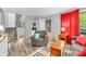 Cozy living room with hardwood floors, grey armchair, patterned rug, and natural light at 1340 Eustis Dr, Indianapolis, IN 46229