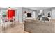 Spacious living room with hardwood floors, TV, stairs, and access to the dining room at 1340 Eustis Dr, Indianapolis, IN 46229