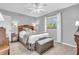 Serene main bedroom featuring a ceiling fan, neutral decor, and a comfortable bed setting at 1340 Eustis Dr, Indianapolis, IN 46229