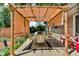 Relaxing patio features a shaded pergola, outdoor seating, and a stylish rug for added comfort at 1340 Eustis Dr, Indianapolis, IN 46229