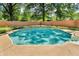 Inviting in-ground pool surrounded by lush greenery and a wooden fence for privacy at 1340 Eustis Dr, Indianapolis, IN 46229