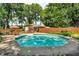 Enjoy swimming in this inviting in-ground pool with meticulously maintained landscaping and multiple seating areas at 1340 Eustis Dr, Indianapolis, IN 46229