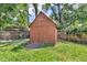 Backyard shed with a double-door entrance for storing tools and gardening equipment at 1340 Eustis Dr, Indianapolis, IN 46229