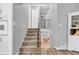 Carpeted staircase leads to the upper level, showcasing the home's interior layout at 1340 Eustis Dr, Indianapolis, IN 46229