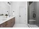 Clean bathroom featuring double sink vanity, quartz countertops and a large glass shower at 1461 Whistle Way, Westfield, IN 46074
