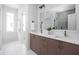 A double sink bathroom featuring quartz countertops, wood cabinets and stylish bronze faucets at 1461 Whistle Way, Westfield, IN 46074
