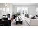 Bright living room with modern fireplace, sliding doors to balcony, and stylish furniture at 1461 Whistle Way, Westfield, IN 46074