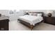 A beautifully staged main bedroom suite has a upholstered headboard and updated color palette at 1461 Whistle Way, Westfield, IN 46074