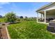 Well-manicured backyard with a large lawn and views of surrounding houses at 15813 Arthur Jacob Ln, Noblesville, IN 46060