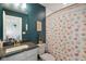Fresh bathroom features stylish vanity, granite countertop, and a whimsical shower curtain at 15813 Arthur Jacob Ln, Noblesville, IN 46060
