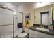 Well-lit bathroom with a tiled shower, a modern vanity, and a neutral color scheme for a clean look at 15813 Arthur Jacob Ln, Noblesville, IN 46060