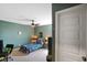 Space themed bedroom with dark green walls and a cozy bed at 15813 Arthur Jacob Ln, Noblesville, IN 46060