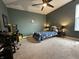 Bedroom with galaxy-themed bed, ceiling fan, and desk area, perfect for any  at 15813 Arthur Jacob Ln, Noblesville, IN 46060