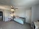 Bedroom features a daybed, ceiling fan with light, desk, and neutral carpeting at 15813 Arthur Jacob Ln, Noblesville, IN 46060
