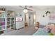 Bright bedroom with decorative fan, closet organizers, cute bathroom, and fun décor at 15813 Arthur Jacob Ln, Noblesville, IN 46060