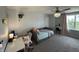 Bedroom offers a daybed, vanity with chair, ceiling fan, and neutral carpeting at 15813 Arthur Jacob Ln, Noblesville, IN 46060