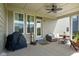 Shaded patio featuring ceiling fan, a grill, and comfortable outdoor seating at 15813 Arthur Jacob Ln, Noblesville, IN 46060