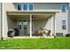 Covered patio with a ceiling fan and outdoor seating area at 15813 Arthur Jacob Ln, Noblesville, IN 46060