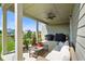 Relaxing covered patio with ceiling fan and comfortable outdoor furniture at 15813 Arthur Jacob Ln, Noblesville, IN 46060