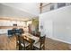 Open concept dining room showcases modern wood flooring, a spacious layout, and seamless flow to a well-appointed kitchen at 15813 Arthur Jacob Ln, Noblesville, IN 46060