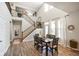 Bright, airy dining room boasts soaring ceilings, large windows with natural light, and seamless flow to other living spaces at 15813 Arthur Jacob Ln, Noblesville, IN 46060