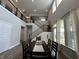 Elegant dining room with high ceilings, large windows, modern decor, and staircase views at 15813 Arthur Jacob Ln, Noblesville, IN 46060
