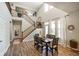 Bright dining room features hardwood floors, high ceilings, and a large window for plenty of natural light at 15813 Arthur Jacob Ln, Noblesville, IN 46060
