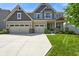 Beautiful two-story home featuring a three-car garage and well-maintained lawn at 15813 Arthur Jacob Ln, Noblesville, IN 46060