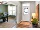 Inviting foyer with hardwood floors, a decorative front door, and a glimpse into an office at 15813 Arthur Jacob Ln, Noblesville, IN 46060
