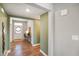 Elegant foyer with hardwood floors, a decorative table, and an open view of the front door at 15813 Arthur Jacob Ln, Noblesville, IN 46060
