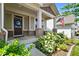 Welcoming front porch with a wreath and comfortable seating nestled in the landscaping at 15813 Arthur Jacob Ln, Noblesville, IN 46060