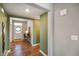 Open hallway with hardwood floors, connecting to the front door and other rooms in the home at 15813 Arthur Jacob Ln, Noblesville, IN 46060