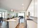 Open concept kitchen features a center island that opens to the dining and living rooms at 15813 Arthur Jacob Ln, Noblesville, IN 46060