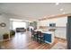 Open kitchen featuring a large island with seating that overlooks the living area and fireplace at 15813 Arthur Jacob Ln, Noblesville, IN 46060