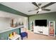 Upstairs living area boasting modern ceiling fan and white shelving to match adjacent living area at 15813 Arthur Jacob Ln, Noblesville, IN 46060