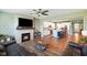 Inviting living room featuring a fireplace, open layout, and seamless transition to the kitchen at 15813 Arthur Jacob Ln, Noblesville, IN 46060