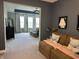 Living room opens to main bedroom and offers ample seating, neutral carpet and paint at 15813 Arthur Jacob Ln, Noblesville, IN 46060