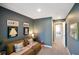 Cozy living room with comfortable seating, gallery wall, and neutral color scheme at 15813 Arthur Jacob Ln, Noblesville, IN 46060