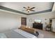 Comfortable main bedroom boasts stylish ceiling fan, dresser, seating area and lots of light at 15813 Arthur Jacob Ln, Noblesville, IN 46060