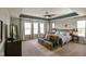 Bright main bedroom features a sitting area, large windows, and comfortable furnishings at 15813 Arthur Jacob Ln, Noblesville, IN 46060