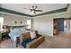 Spacious main bedroom with a sitting area, accent ceiling, and ample natural light at 15813 Arthur Jacob Ln, Noblesville, IN 46060